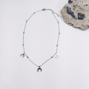 Colgante detalle medias lunas y bolitas en plateado